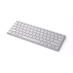 A Photo Of Microsoft Designer Compact Keyboard - Glacier | Wireless Productivity Keyboard with Emoji Key