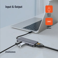 A Photo Of Porodo 4-in-1 USB-C Hub with 100W PD, 4K HDMI, USB 3.0 & 3.5mm Aux – Grey