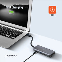 A Photo Of Porodo 4-in-1 USB-C Hub with 100W PD, 4K HDMI, USB 3.0 & 3.5mm Aux – Grey