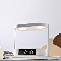 A Photo Of Porodo Bedside Lamp with Wireless Charging, Digital Alarm Clock, and Touch-Dimming - White