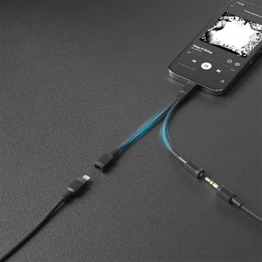 A Photo Of Porodo 2in1 Lightning to Lightning + 3.5 Jack Headphone and Charging Converter Adapter