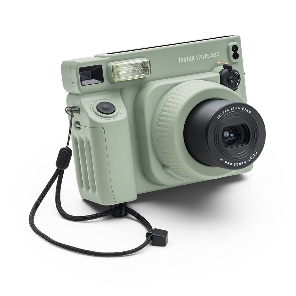 A Photo Of Fujifilm Instax Wide 400 Instant Film Camera – Green | Automatic Exposure & Adjustable Angle for Perfect Group Shots